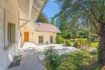 Discover this charming property featuring a welcoming front entrance and an expansive outdoor patio, perfect for entertaining.