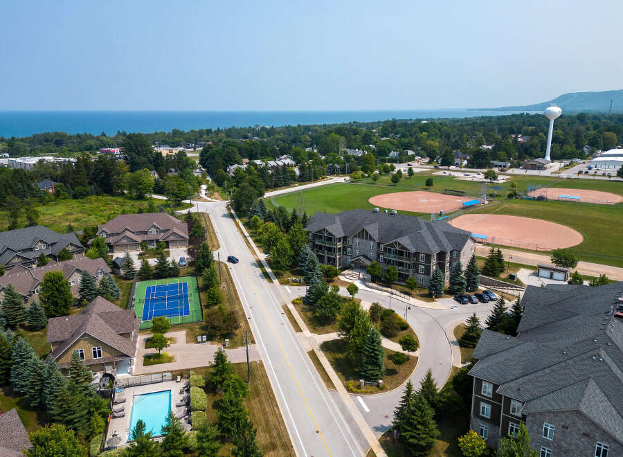 This aerial view showcases a vibrant residential area with diverse amenities.