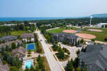 This aerial view showcases a vibrant residential area with diverse amenities.