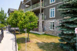 Discover upscale living in this multi-story apartment complex with beautiful stone accents and inviting green balconies.