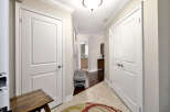 This inviting hallway features classic white doors that offer privacy to various rooms.