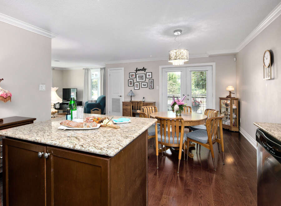 This inviting home features an open concept kitchen and dining area, perfect for entertaining.