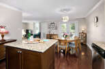 This inviting home features an open concept kitchen and dining area, perfect for entertaining.