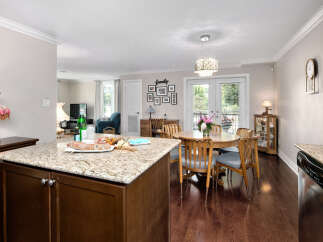 This inviting home features an open concept kitchen and dining area, perfect for entertaining.
