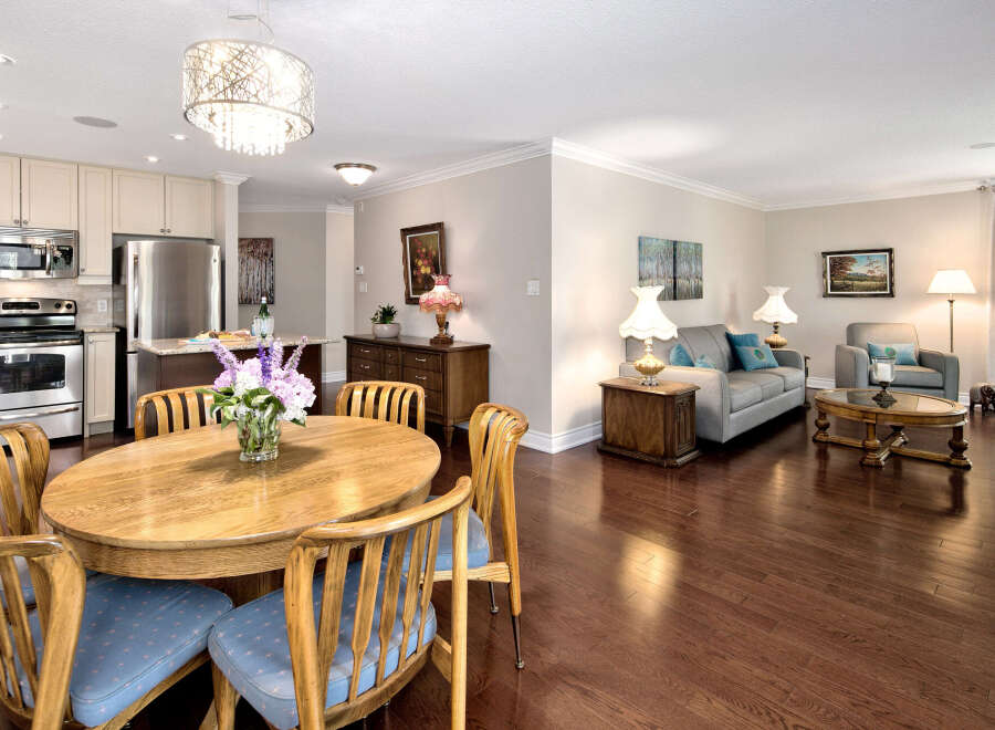 Step into this inviting open-concept living space, seamlessly blending the kitchen, dining, and living areas.
