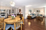 Step into this inviting open-concept living space, seamlessly blending the kitchen, dining, and living areas.