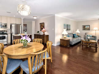 Step into this inviting open-concept living space, seamlessly blending the kitchen, dining, and living areas.