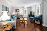 This elegant living room boasts hardwood floors, neutral paint, and stylish furnishings, creating a warm and inviting atmosphere.