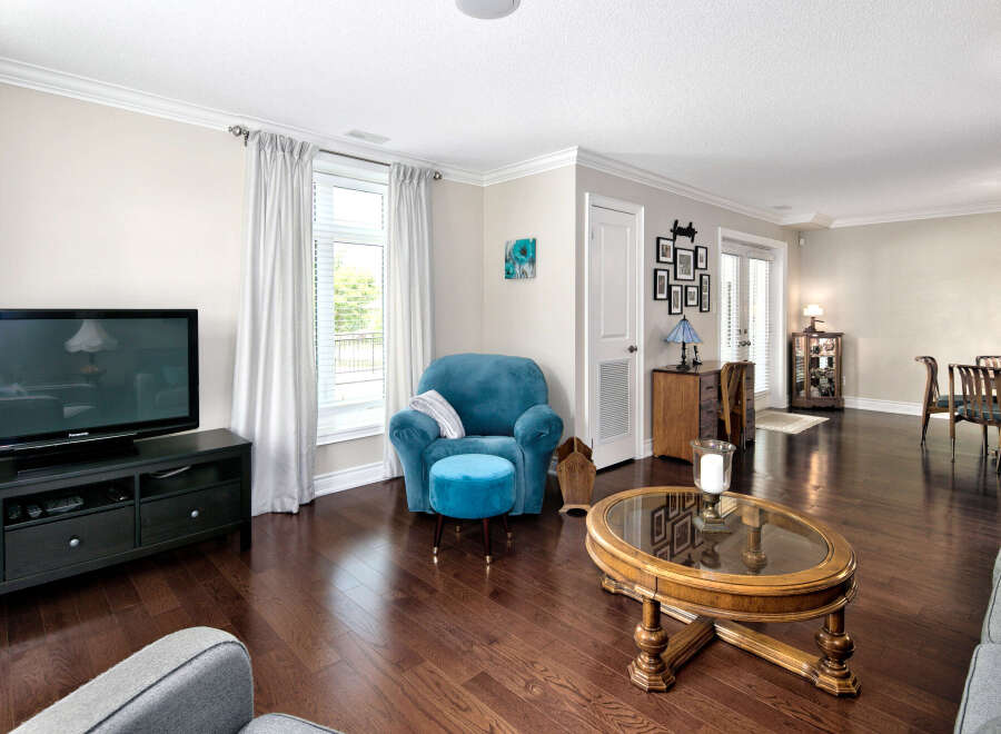 Step into this inviting living space featuring rich hardwood floors that amplify the natural light.