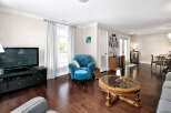 Step into this inviting living space featuring rich hardwood floors that amplify the natural light.