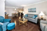 Step into this inviting living space, featuring rich hardwood floors that complement the neutral walls.