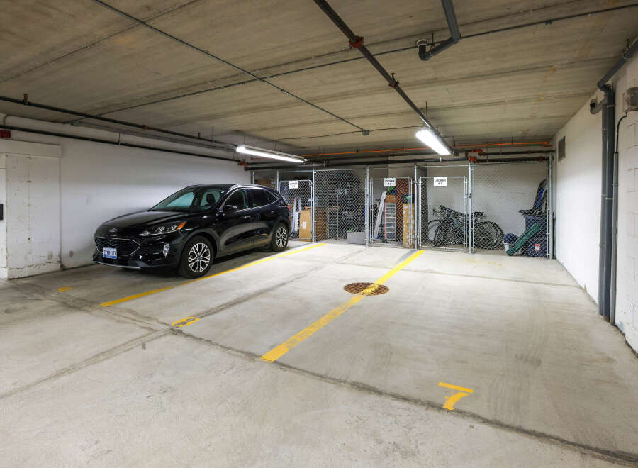 This parking spot is in a well-lit, secured garage, offering convenience and safety for residents.