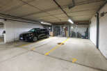 This parking spot is in a well-lit, secured garage, offering convenience and safety for residents.