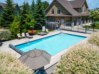 Discover resort-style living with this property featuring a sparkling outdoor pool, perfect for relaxation and recreation.
