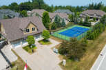 Discover luxury living in this stunning property featuring a private tennis court and meticulously landscaped grounds.