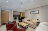 Discover this cozy apartment featuring a well-equipped kitchen, perfect for preparing meals.