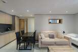 Discover this cozy apartment featuring a well-equipped kitchen, perfect for preparing meals.