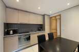 This charming kitchen features modern appliances and ample cabinet space, perfect for preparing delicious meals.