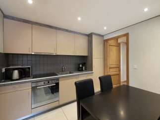 This charming kitchen features modern appliances and ample cabinet space, perfect for preparing delicious meals.