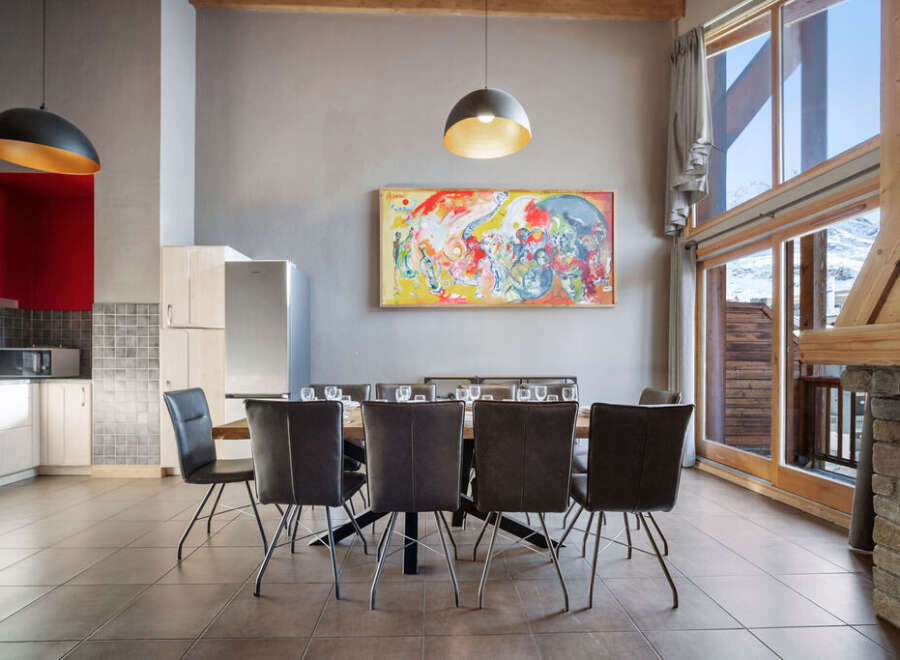 This stunning property boasts a modern dining area, perfect for entertaining guests.