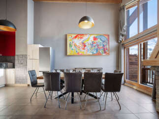 This stunning property boasts a modern dining area, perfect for entertaining guests.