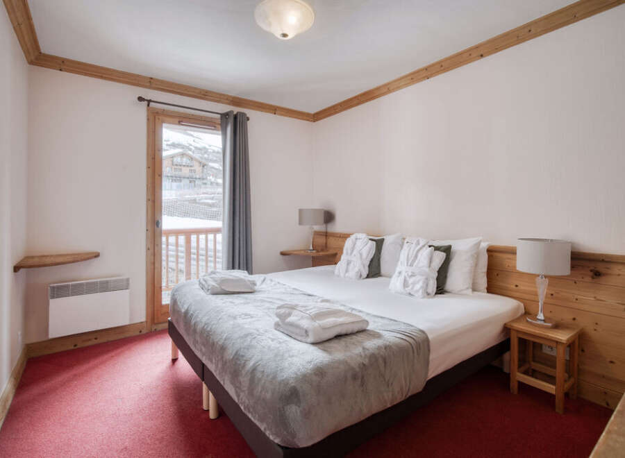 Experience the ultimate comfort in this cozy bedroom, perfect for a relaxing getaway.