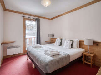 Experience the ultimate comfort in this cozy bedroom, perfect for a relaxing getaway.