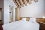 This cozy bedroom features two twin beds, perfect for guests or roommates.