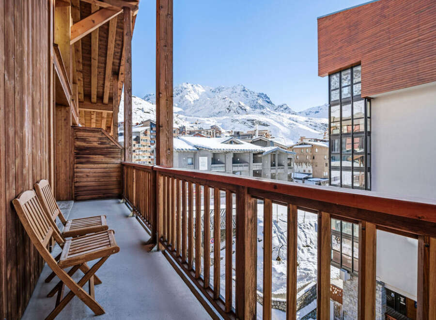 Enjoy breathtaking mountain views from this charming balcony.