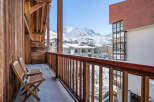 Enjoy breathtaking mountain views from this charming balcony.