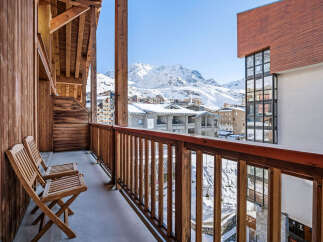 Enjoy breathtaking mountain views from this charming balcony.