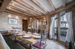 This charming dining room features a rustic wooden design, creating a warm and inviting atmosphere.