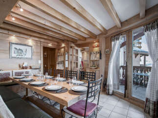 This charming dining room features a rustic wooden design, creating a warm and inviting atmosphere.