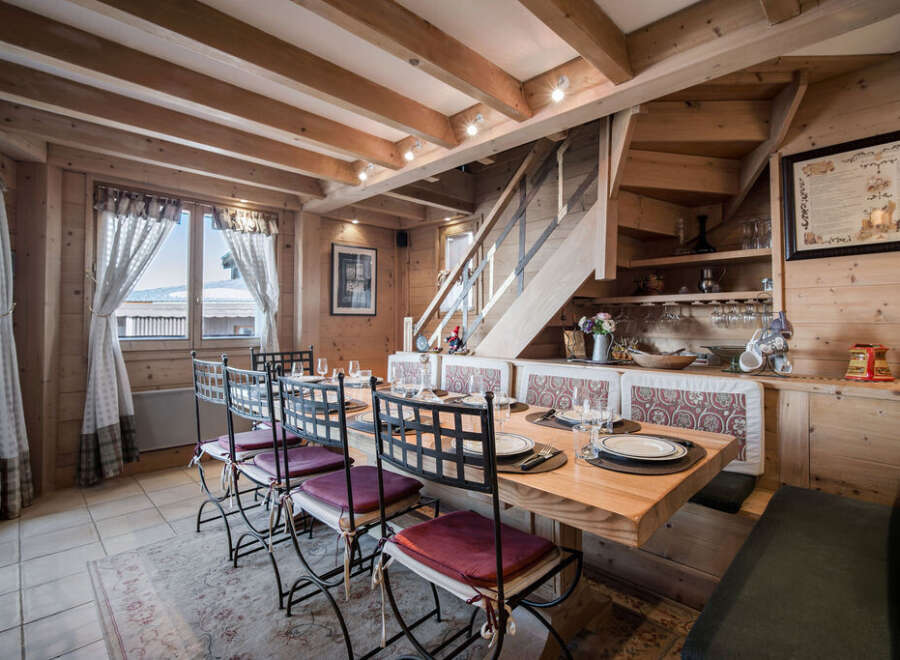 Step into this charming dining area, featuring a rustic wooden design that exudes warmth and character.