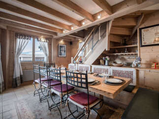 Step into this charming dining area, featuring a rustic wooden design that exudes warmth and character.