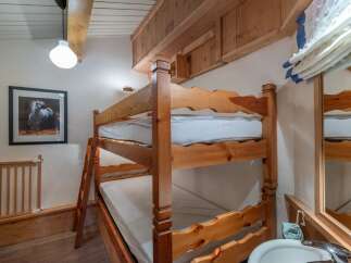 This charming property features a cozy bunk bed, perfect for accommodating guests or family members.