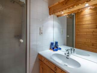 This charming bathroom features a bright and airy design, perfect for starting your day.