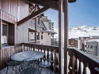 Enjoy breathtaking mountain views from this charming balcony.