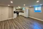 This inviting kitchen boasts modern appliances and ample counter space, perfect for culinary enthusiasts.