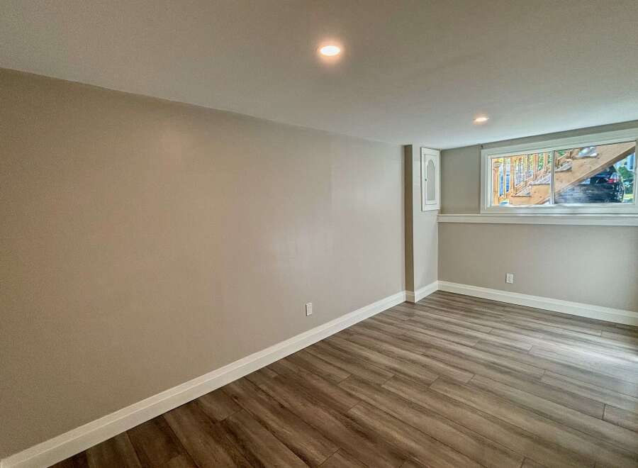 This inviting room features a neutral color palette, creating a versatile space ready for your personal touch.