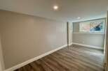 This inviting room features a neutral color palette, creating a versatile space ready for your personal touch.