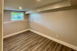 This inviting room features a neutral color palette, creating a versatile space ready for your personal touch.
