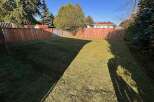 Enjoy the tranquility of this spacious backyard, perfect for outdoor activities and relaxation.