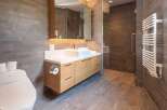 Step into a modern bathroom oasis, featuring sleek design and luxurious finishes.