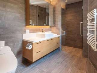 Step into a modern bathroom oasis, featuring sleek design and luxurious finishes.
