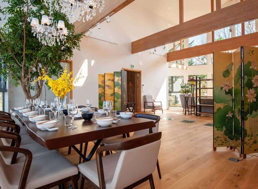 Experience luxury living in this stunning property, featuring a spacious dining area perfect for entertaining.