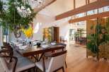 Experience luxury living in this stunning property, featuring a spacious dining area perfect for entertaining.