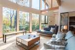Experience the epitome of luxury living in this stunning property, boasting expansive windows that frame breathtaking views of the surrounding natural landscape.