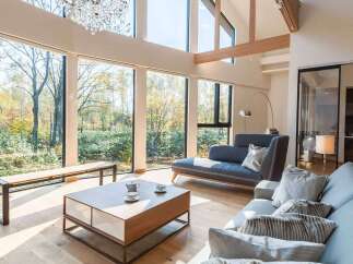 Experience the epitome of luxury living in this stunning property, boasting expansive windows that frame breathtaking views of the surrounding natural landscape.
