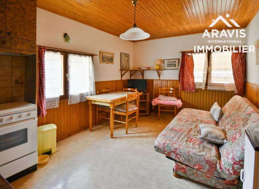 Discover the charm of this cozy property! Featuring a warm, inviting interior with wooden paneling and a functional layout.